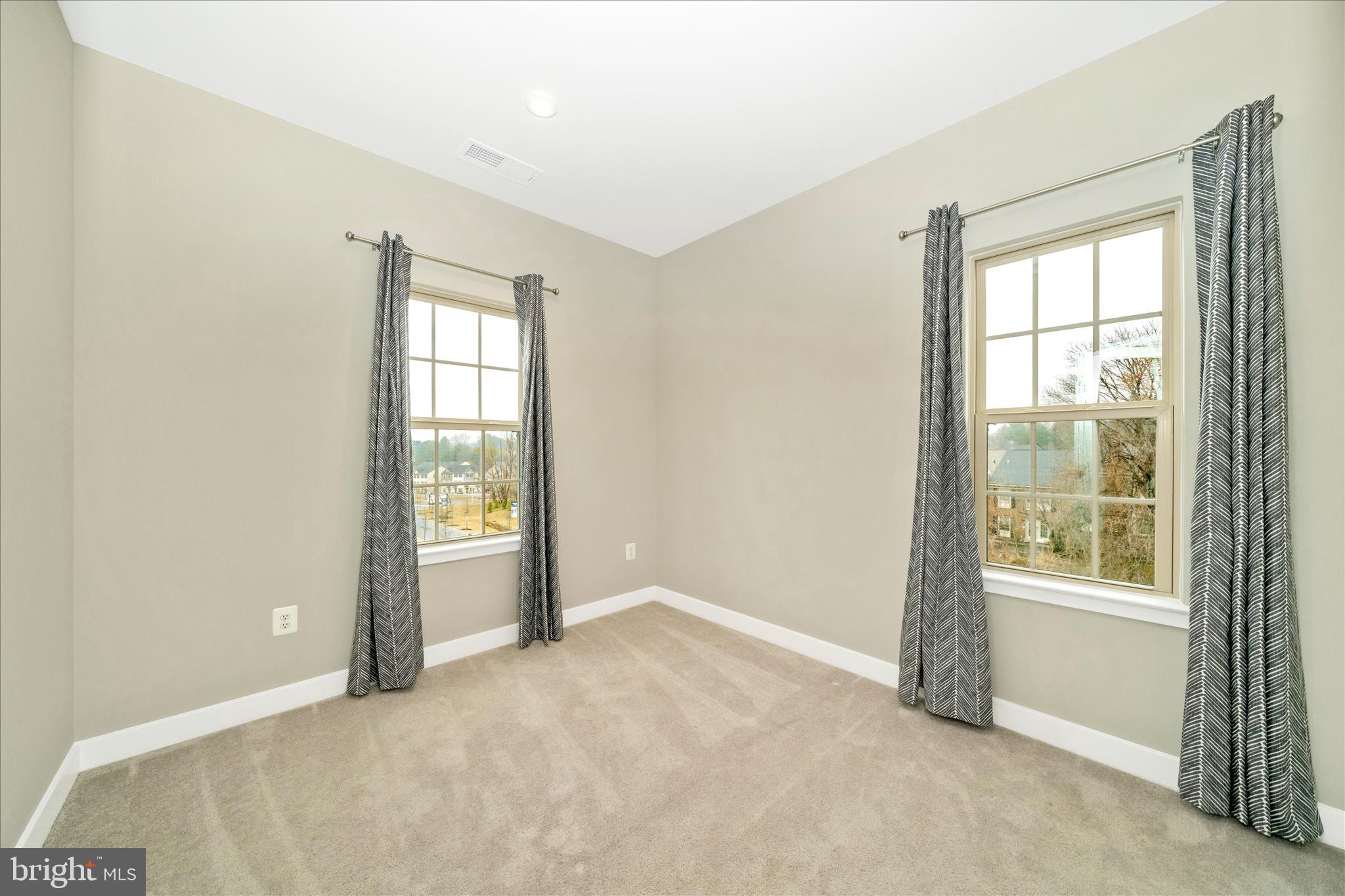 9537 Tall Oaks Road Montgomery Village, MD 20886 - Photo 34 of 53 an empty room with windows