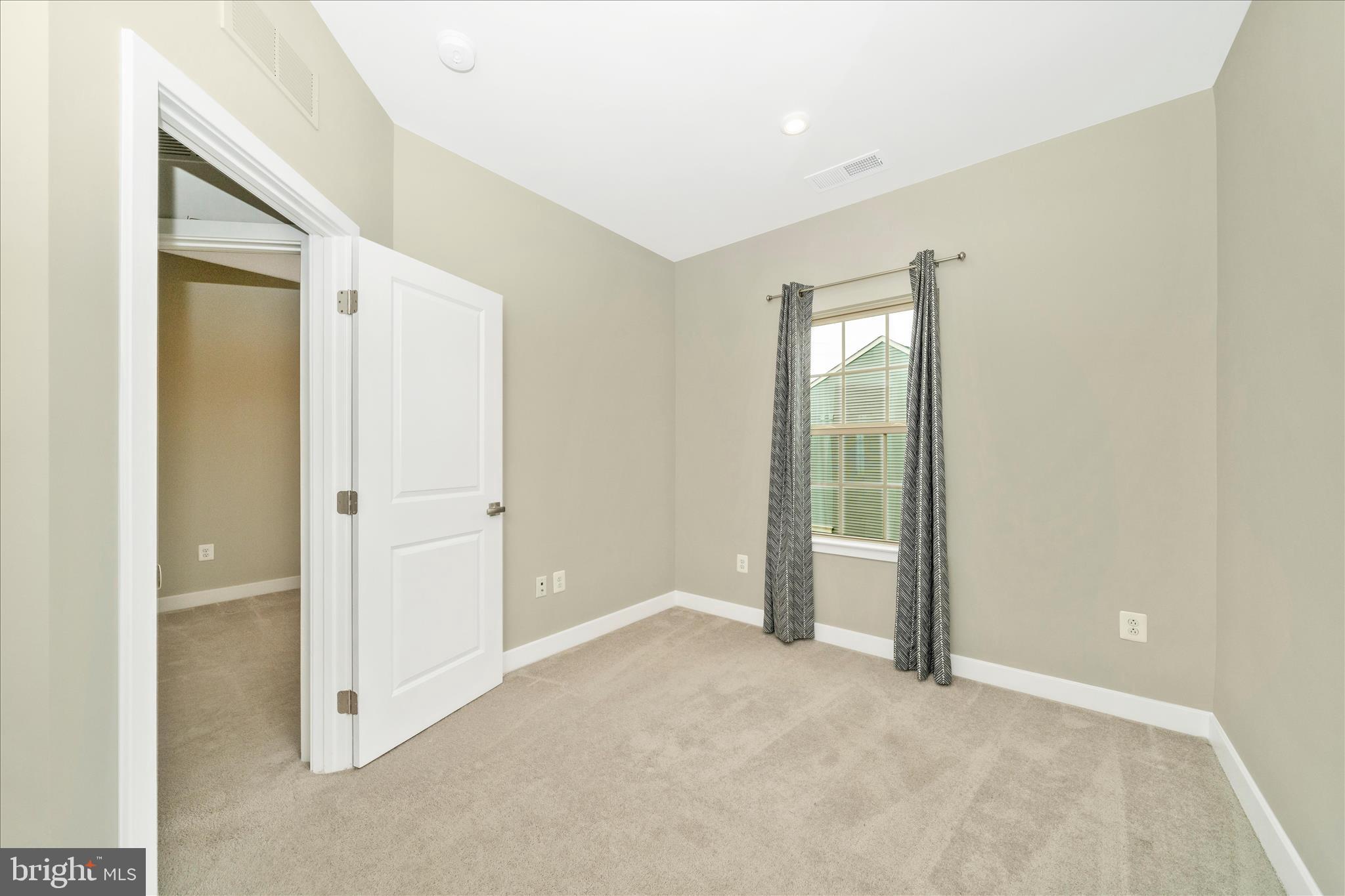 9537 Tall Oaks Road Montgomery Village, MD 20886 - Photo 36 of 53 an empty room with windows and closet