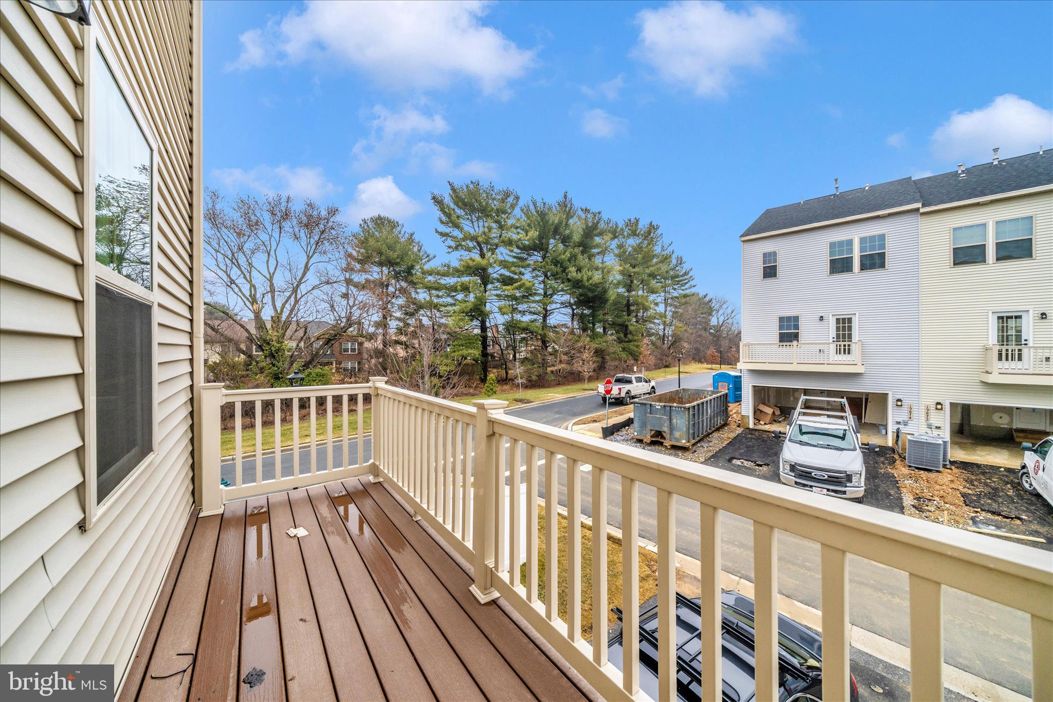 9537 Tall Oaks Road Montgomery Village, MD 20886 - Photo 40 of 53 a view of a balcony with wooden floor and fence
