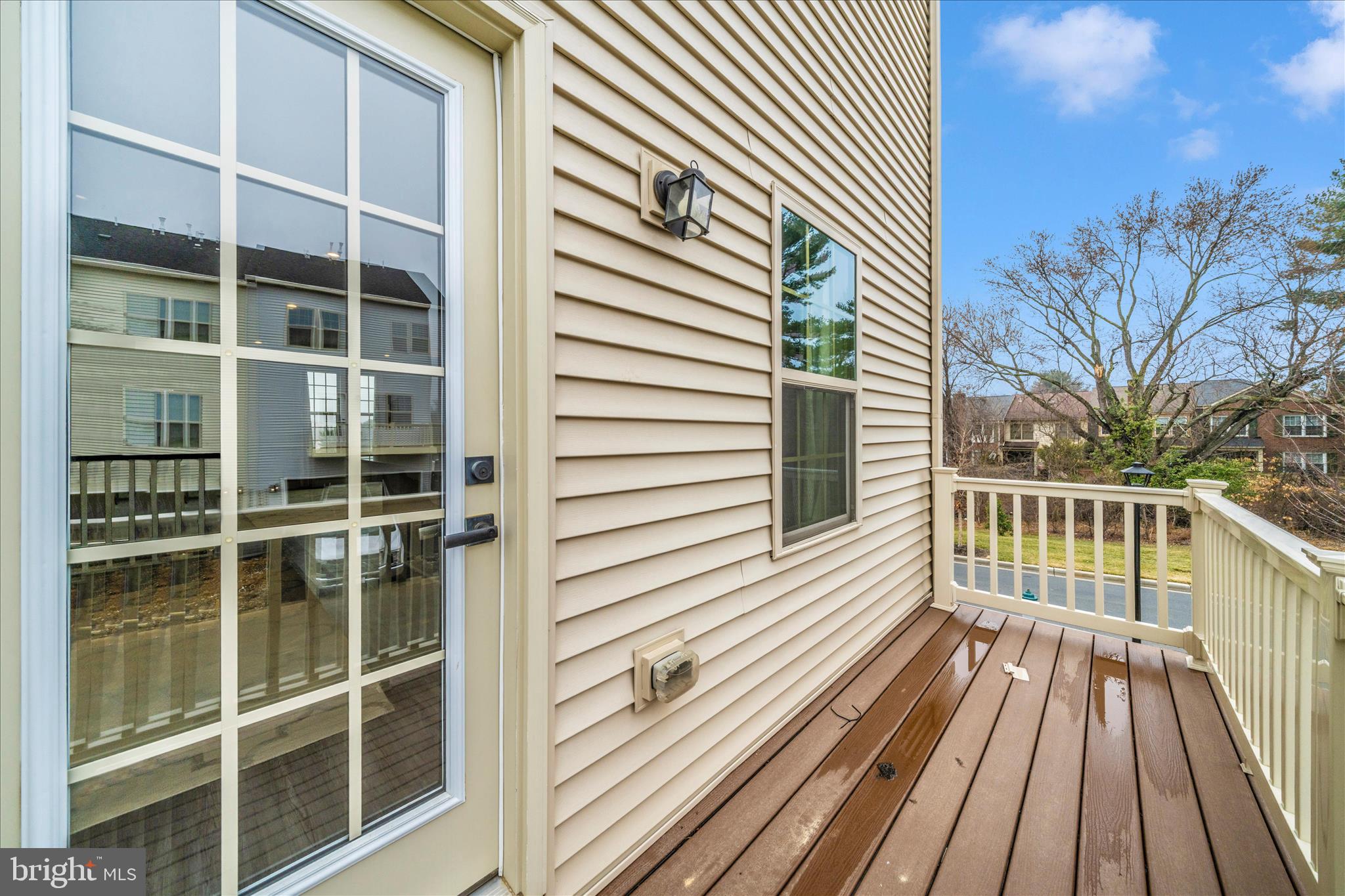 9537 Tall Oaks Road Montgomery Village, MD 20886 - Photo 41 of 53 a view of a balcony with wooden floor and fence