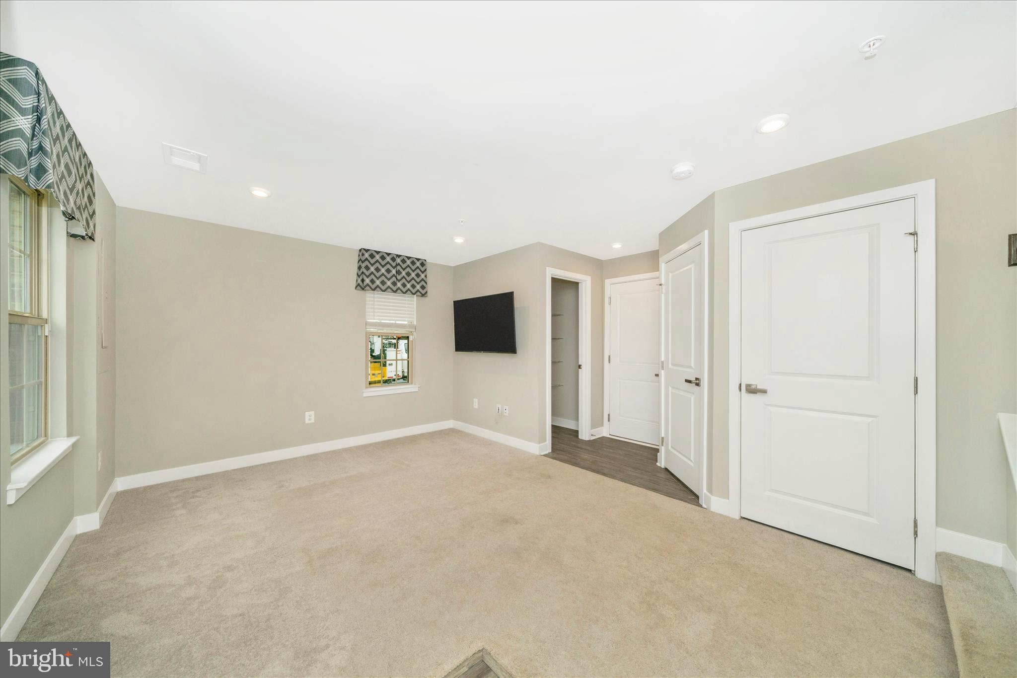 9537 Tall Oaks Road Montgomery Village, MD 20886 - Photo 5 of 53 a view of a big room with wooden floor and windows