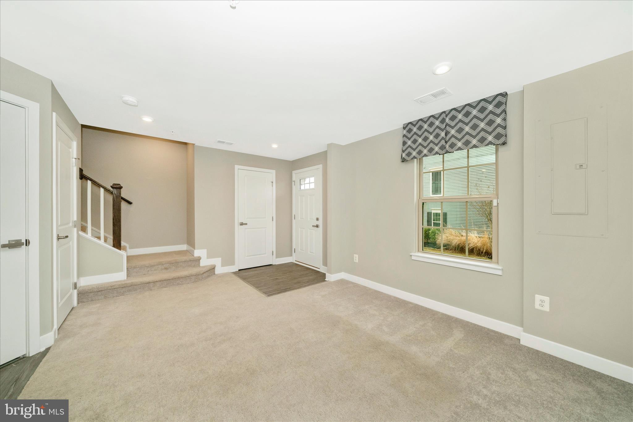 9537 Tall Oaks Road Montgomery Village, MD 20886 - Photo 7 of 53 a view of an empty room with a window