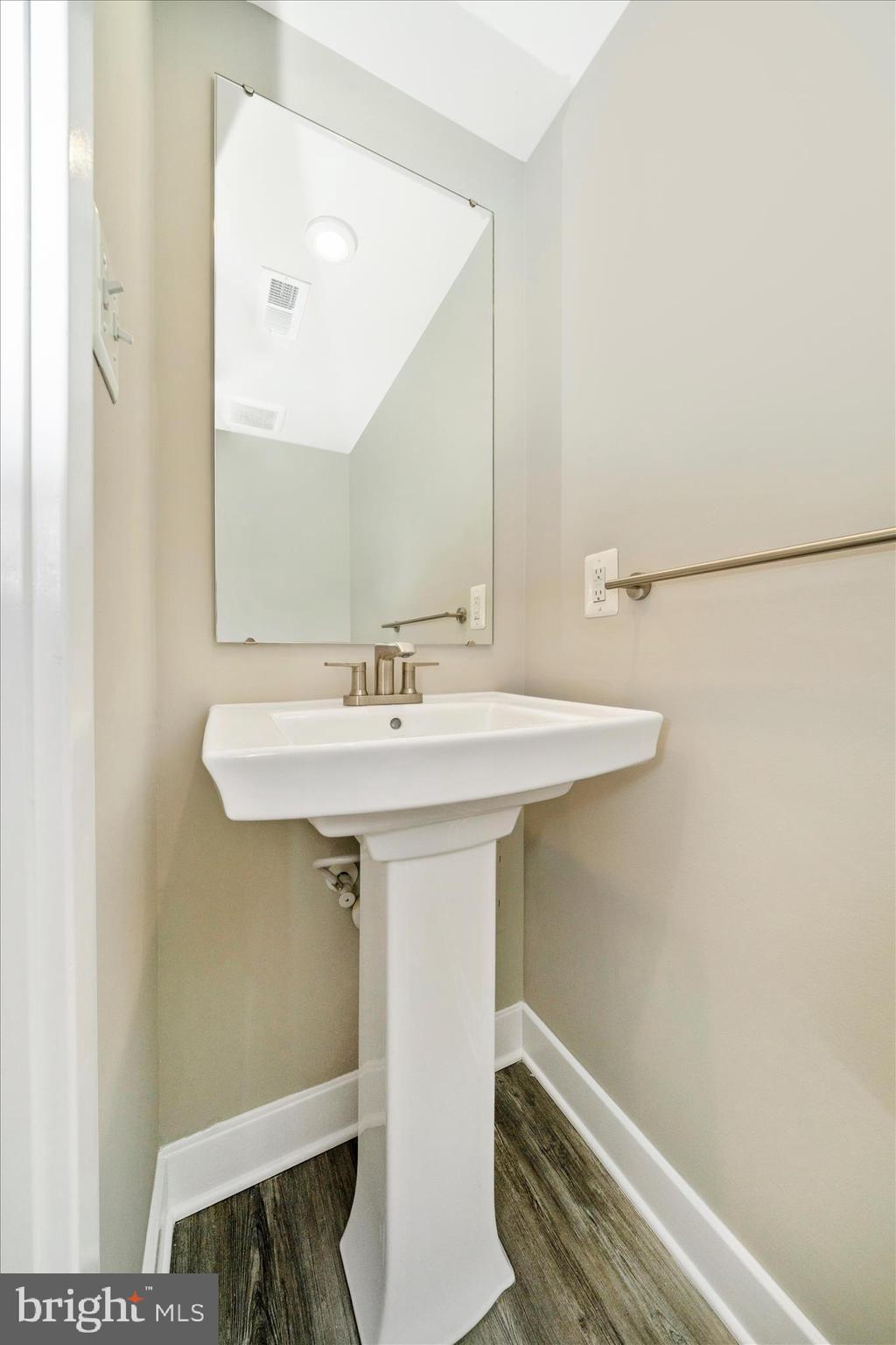 9537 Tall Oaks Road Montgomery Village, MD 20886 - Photo 8 of 53 a bathroom with a sink and a mirror