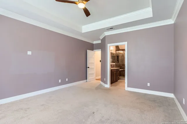 a bathroom with a granite countertop sink a large mirror and a shower