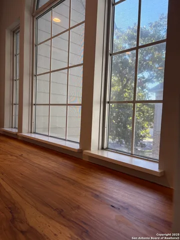 a view of a hallway with windows