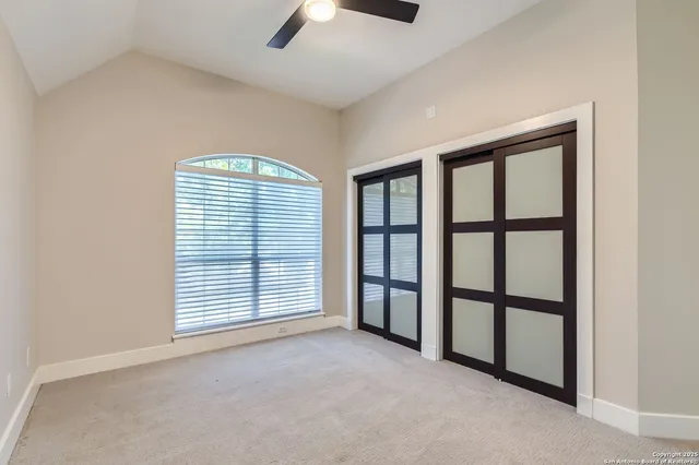 a living room with a couch and a window