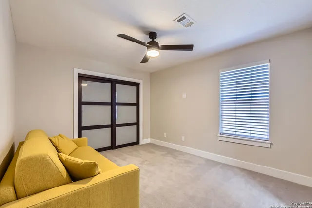 a bathroom with a double vanity sink and mirror
