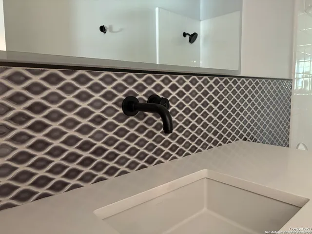 an empty room with a empty shelves and windows