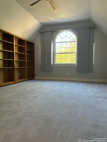 a front view of a house with a yard and a garage
