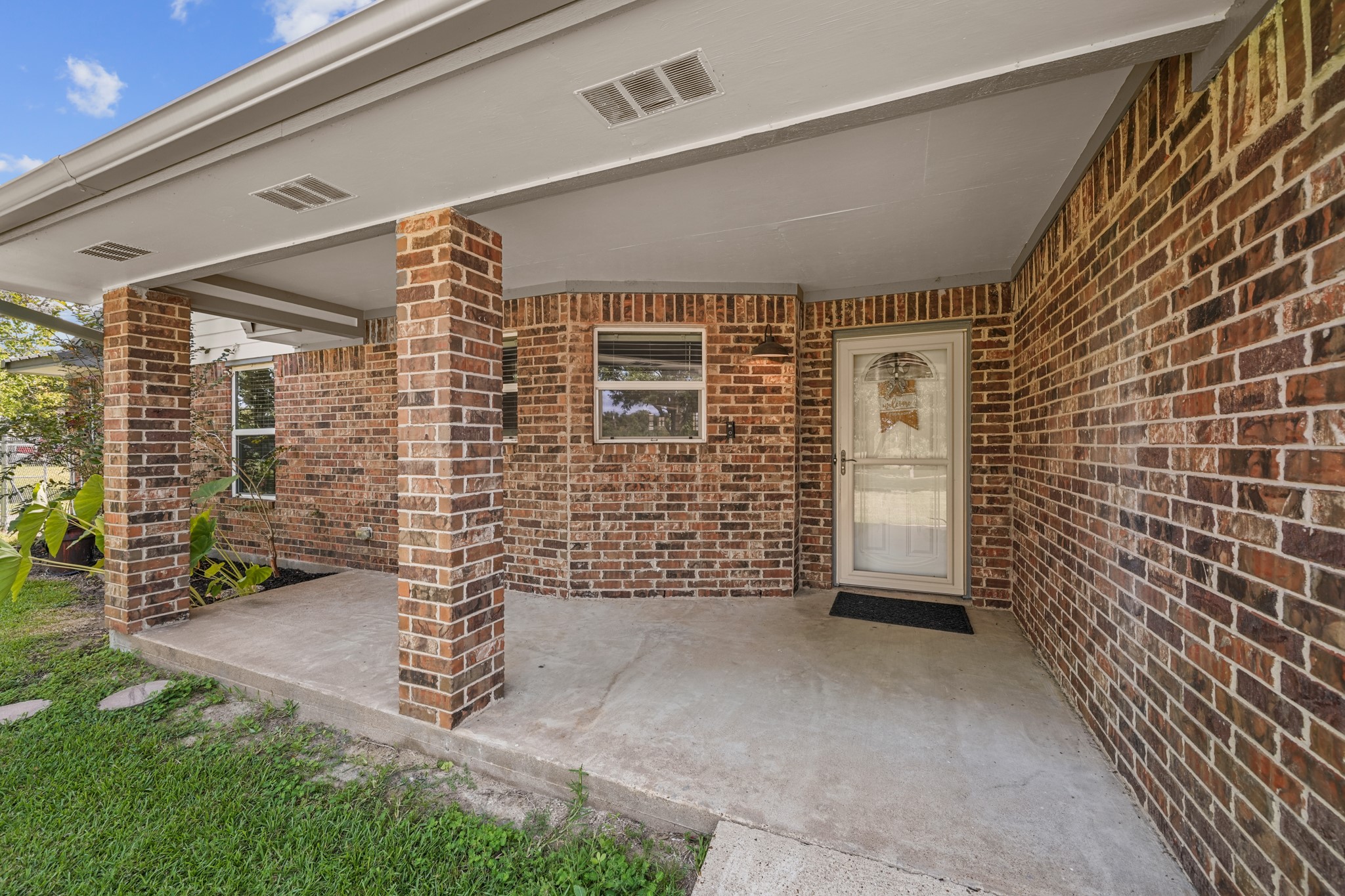 4435 South Tower Road Santa Fe, TX 77517 - Photo 3 of 35 A covered front porch provides a warm welcome and the perfect place to relax with your morning coffee before stepping inside.