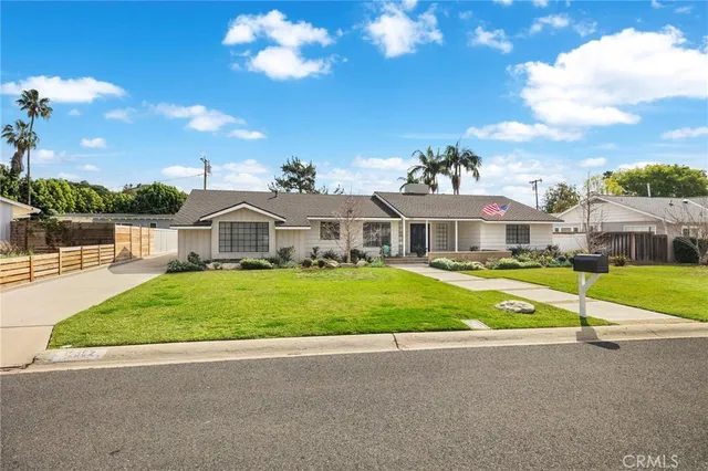 a large kitchen with stainless steel appliances granite countertop a stove and a sink
