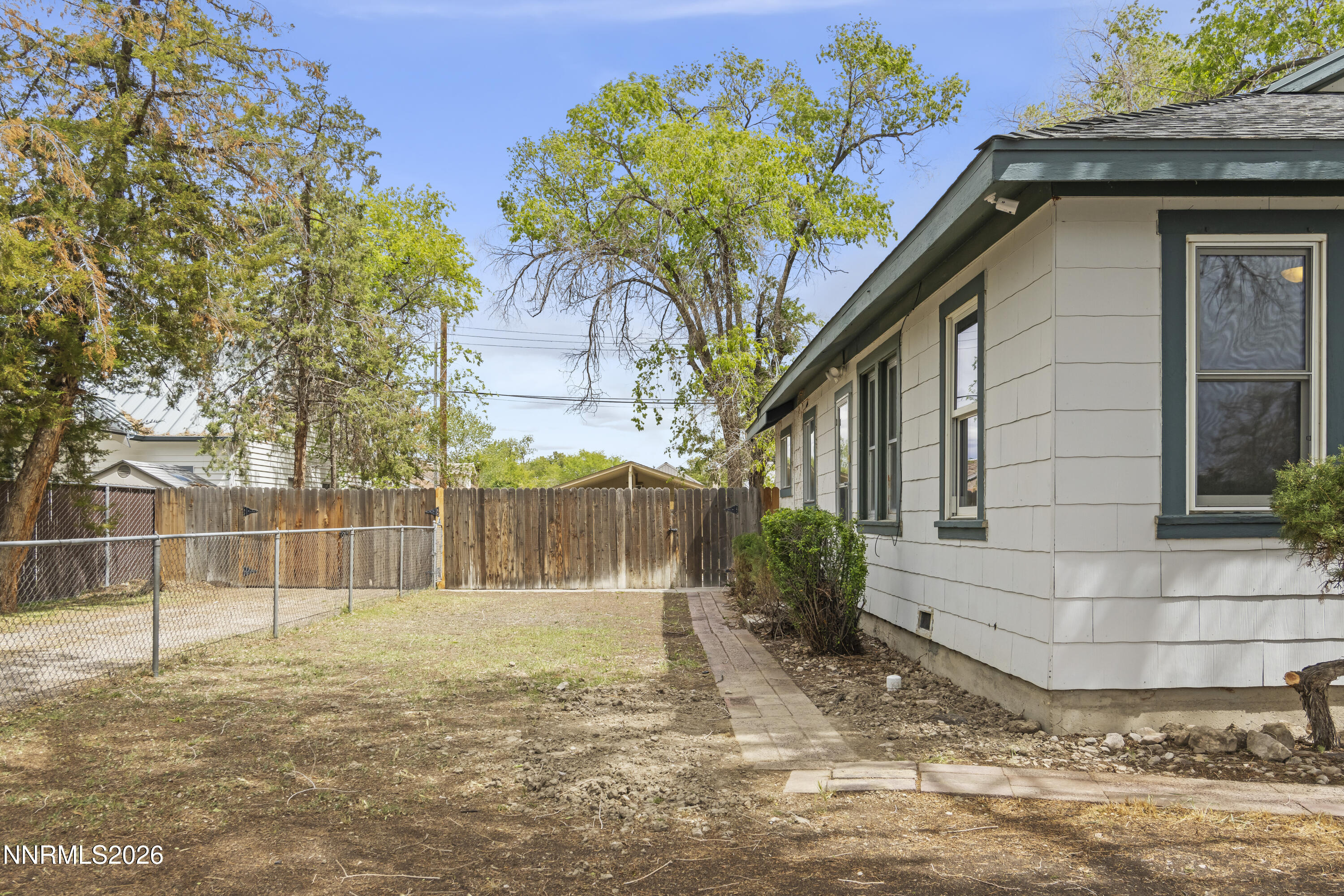 511 Churchill Street Fallon, NV 89406 - Photo 2 of 37 a house with a tree in front of it