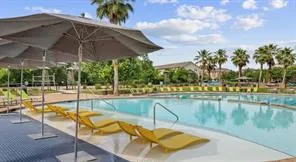 a view of a swimming pool with a patio