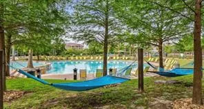 a view of a swimming pool with a patio