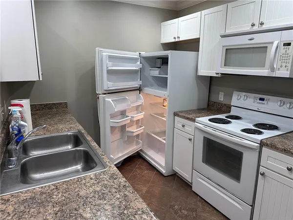 a kitchen with a stove microwave and refrigerator