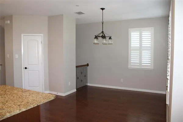 a stove top oven sitting inside of a kitchen