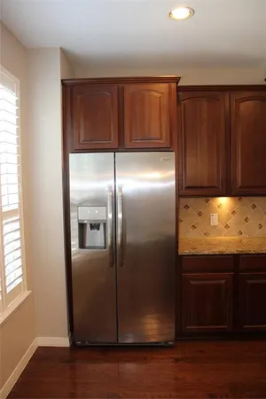 a kitchen with a stove a sink and a microwave