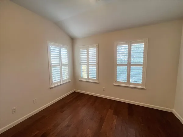 a view of front door with wooden floor