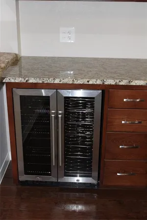 a kitchen with a sink and a mirror
