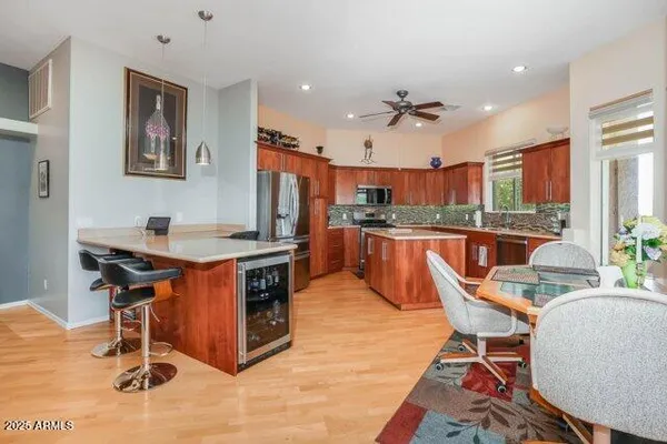 a kitchen with a table and chairs