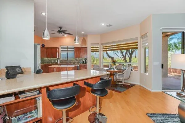 a kitchen with stainless steel appliances a stove refrigerator sink and microwave