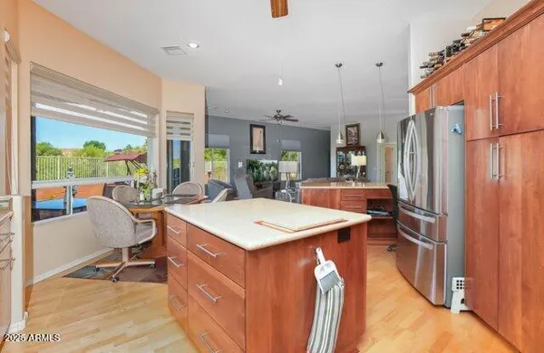 a view of a dining room with furniture a chandelier and wooden floor