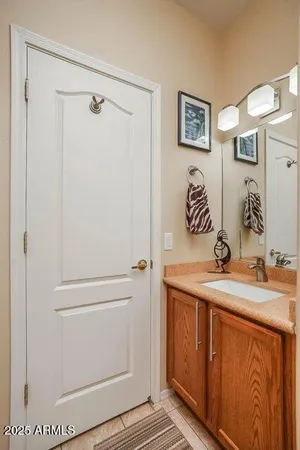 a bathroom with a toilet mirror and vanity
