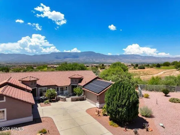 a view of a patio with a table under an umbrella