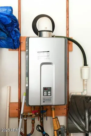 a backyard of a house with wooden fence and large trees