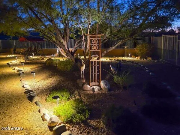 a living room with fireplace furniture and a chandelier