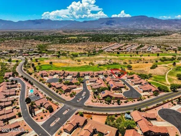 a view of a swimming pool with an ocean view