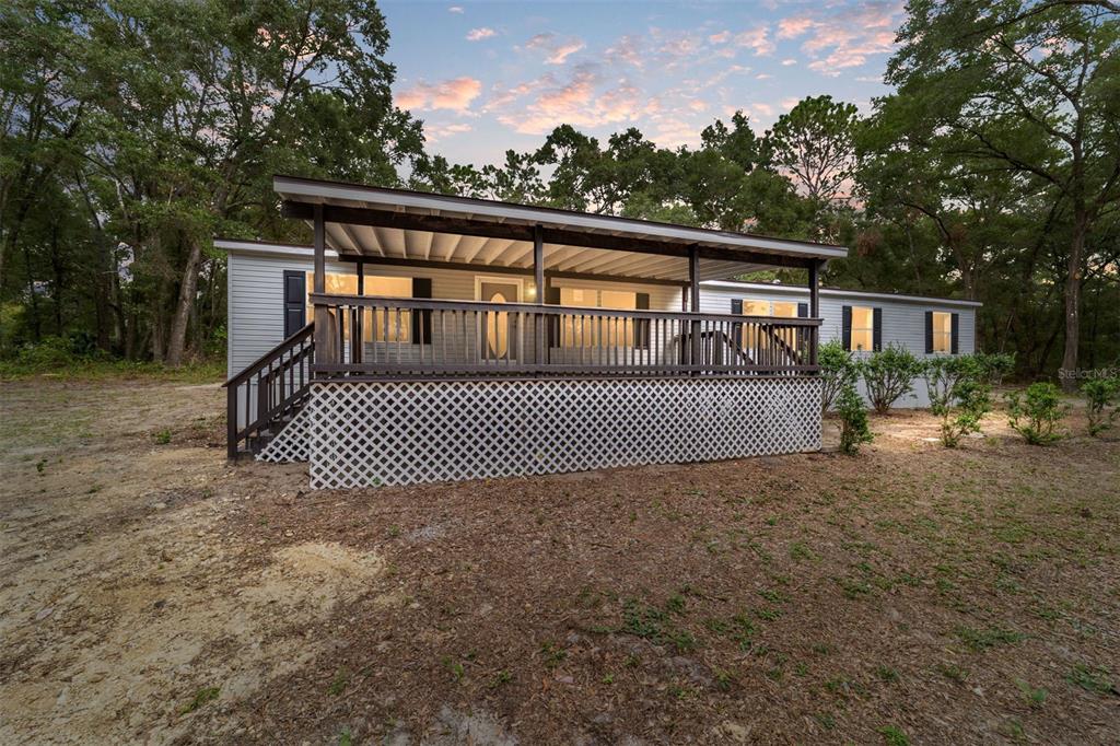 18075 Southwest 60th Street Dunnellon, FL 34432 - Photo 1 of 1 a view of a house with a roof deck