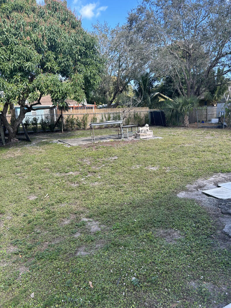 6793 4th Street Jupiter, FL 33458 - Photo 14 of 14 a view of a house with a yard