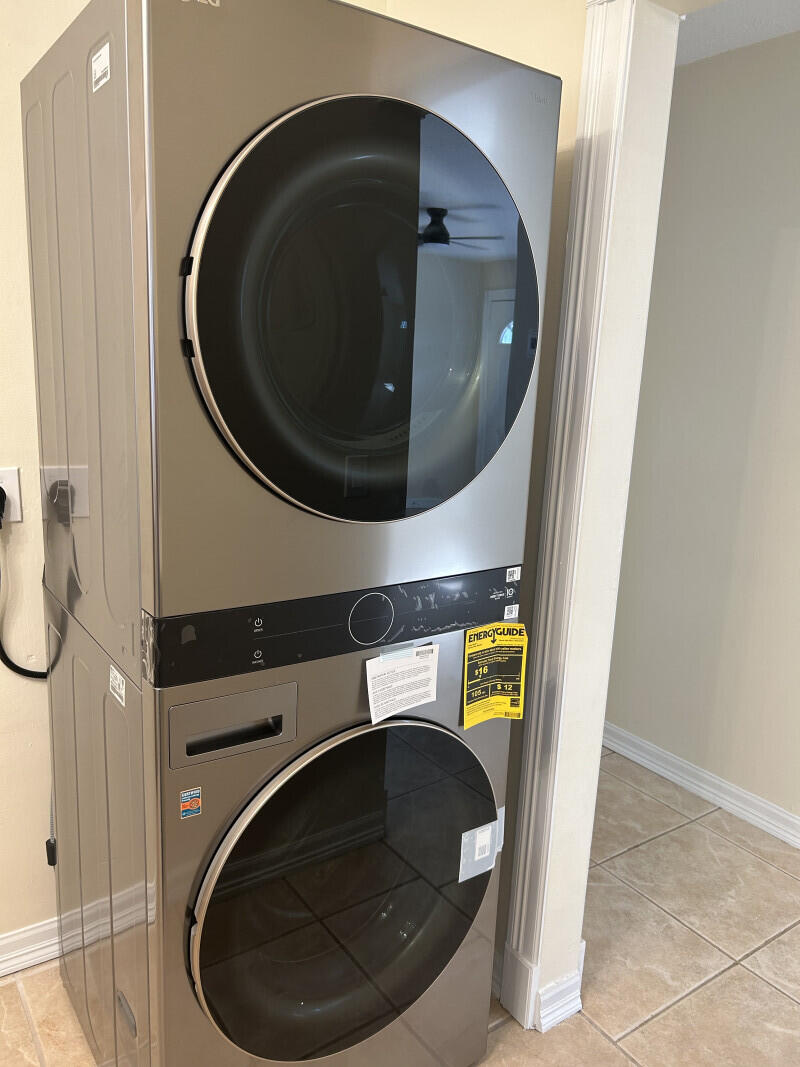 6793 4th Street Jupiter, FL 33458 - Photo 7 of 14 a utility room with dryer and washer
