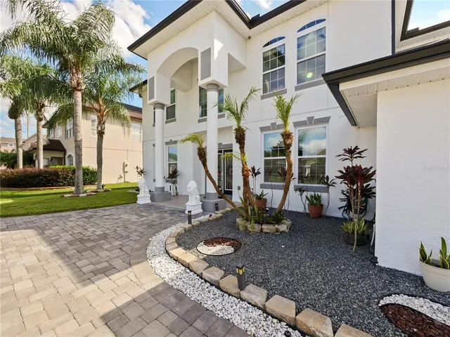 a front view of a house with outdoor seating