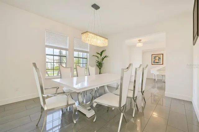 a view of a room with a wooden table and chair