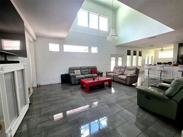 a bathroom with a granite countertop sink mirror vanity and toilet