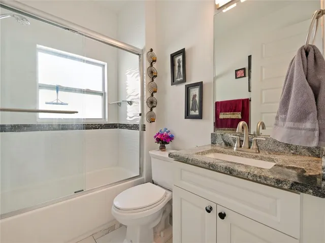 a bedroom with a bed and a table in it