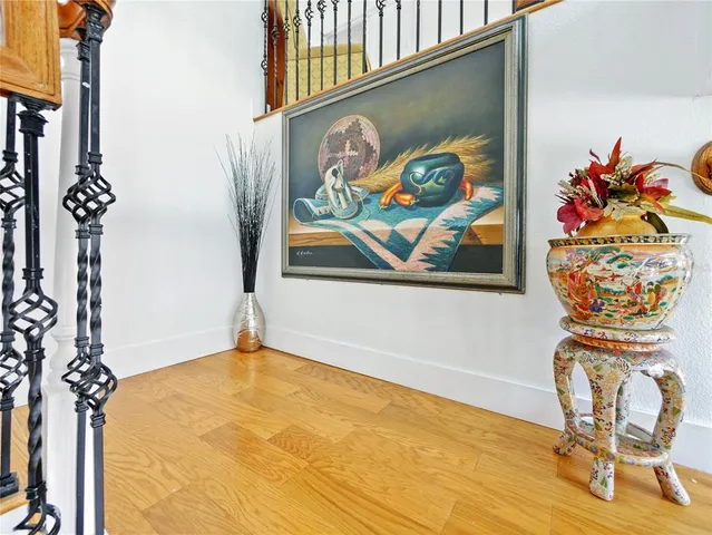 a view of entryway with wooden floor and stairs