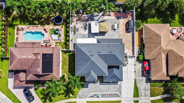 an aerial view of residential houses with outdoor space
