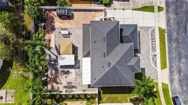 an aerial view of residential house with outdoor space and swimming pool
