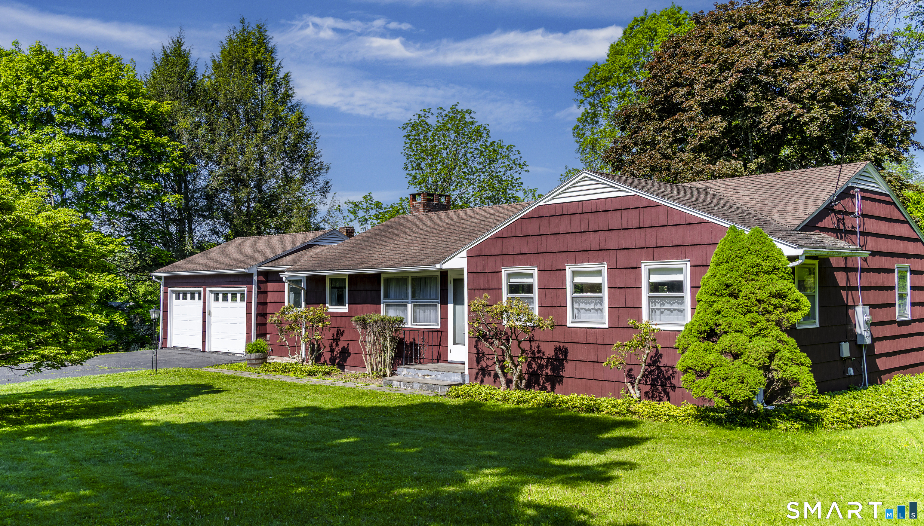 39 Indian Mountain Road Salisbury, CT 06039 - Photo 1 of 16 a front view of a house with a yard table and chairs
