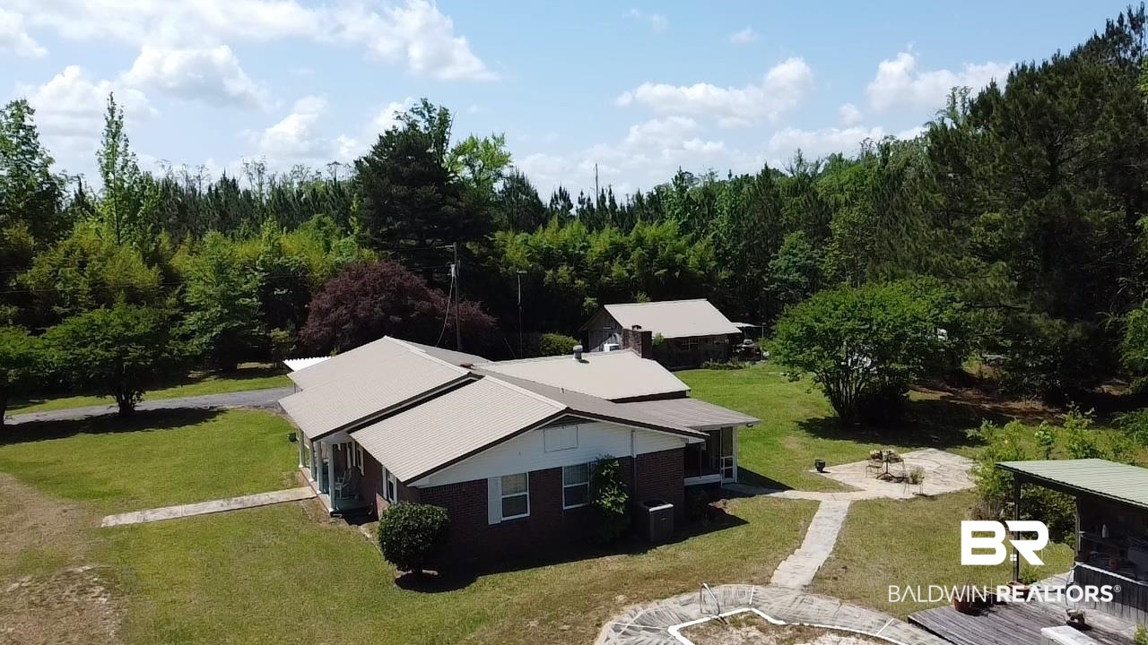 315 Dawkins Road Brewton, AL 36426 - Photo 1 of 19 Drone / aerial view with a wooded view