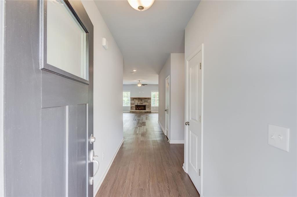 0 Harvest Church Road, Unit 1 Clarkesville, GA 30523 - Photo 6 of 38 a view of a hallway with wooden floor and a bathroom