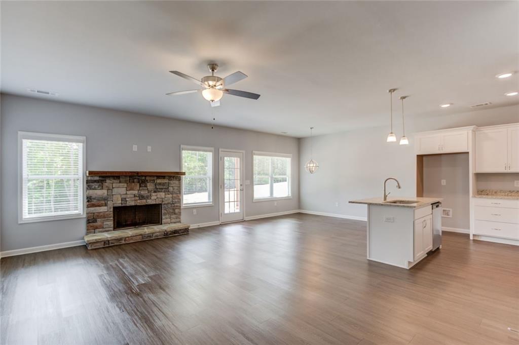 0 Harvest Church Road, Unit 1 Clarkesville, GA 30523 - Photo 9 of 38 a view of a kitchen with a sink a fireplace and wooden floor