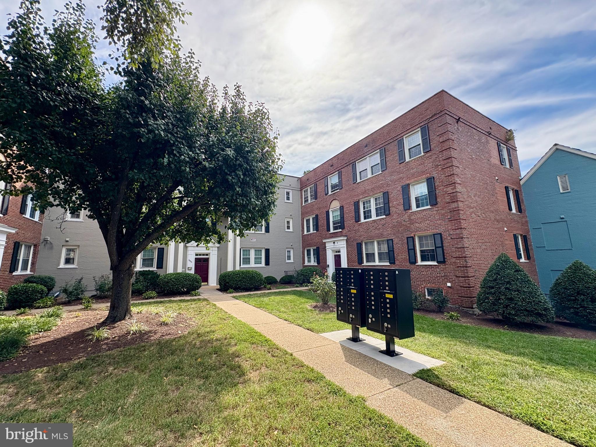 a view of house with yard in front of it