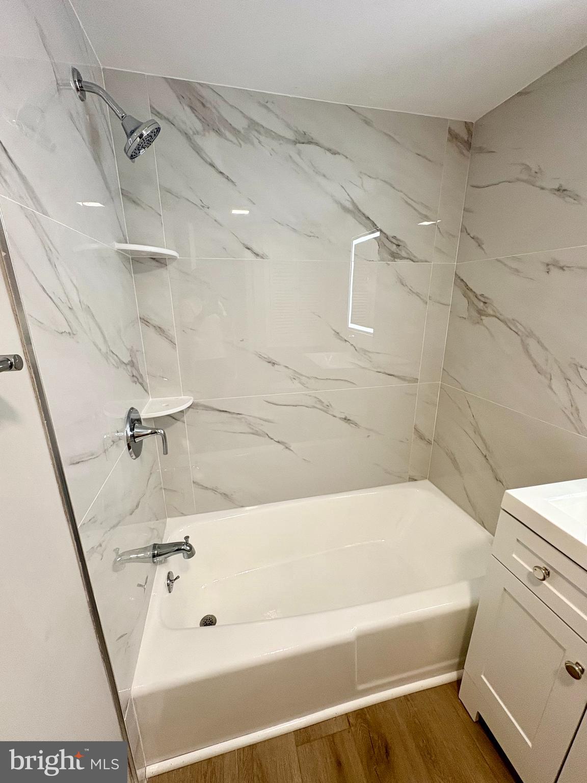 2008 38th Street Southeast, Unit 302 Washington, DC 20020 - Photo 13 of 25 a bathroom with a tub and toilet