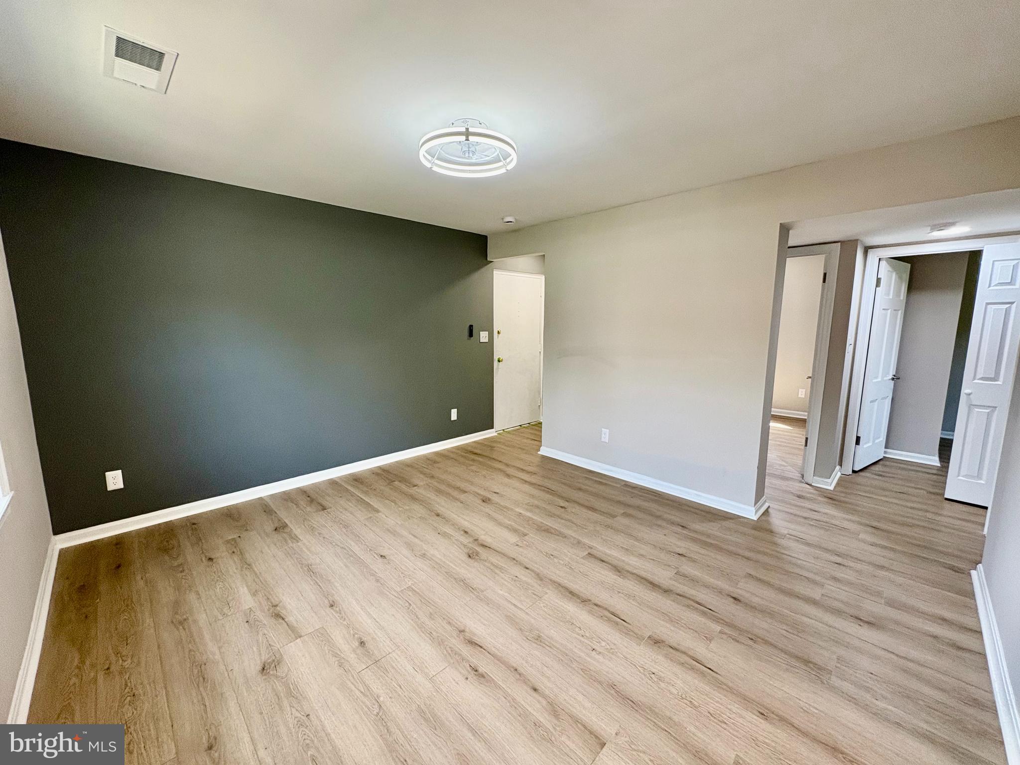 2008 38th Street Southeast, Unit 302 Washington, DC 20020 - Photo 3 of 25 a view of empty room with wooden floor