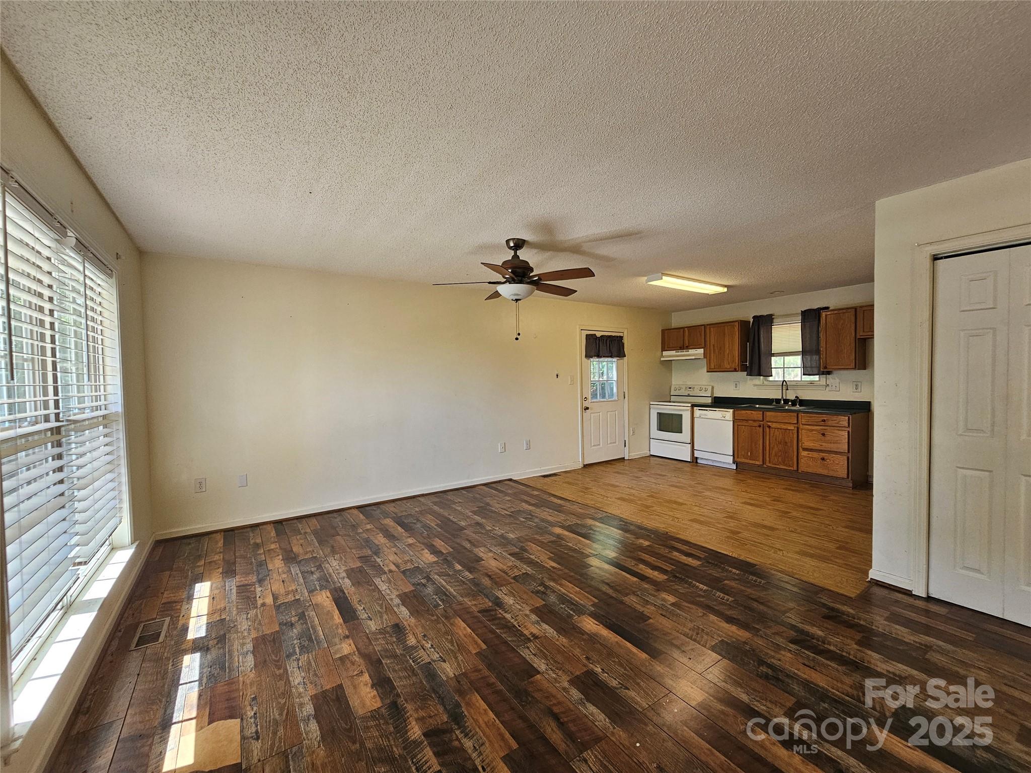 130 Susan Road, Unit 2 Casar, NC 28020 - Photo 2 of 12 wooden floor in an empty room with a window