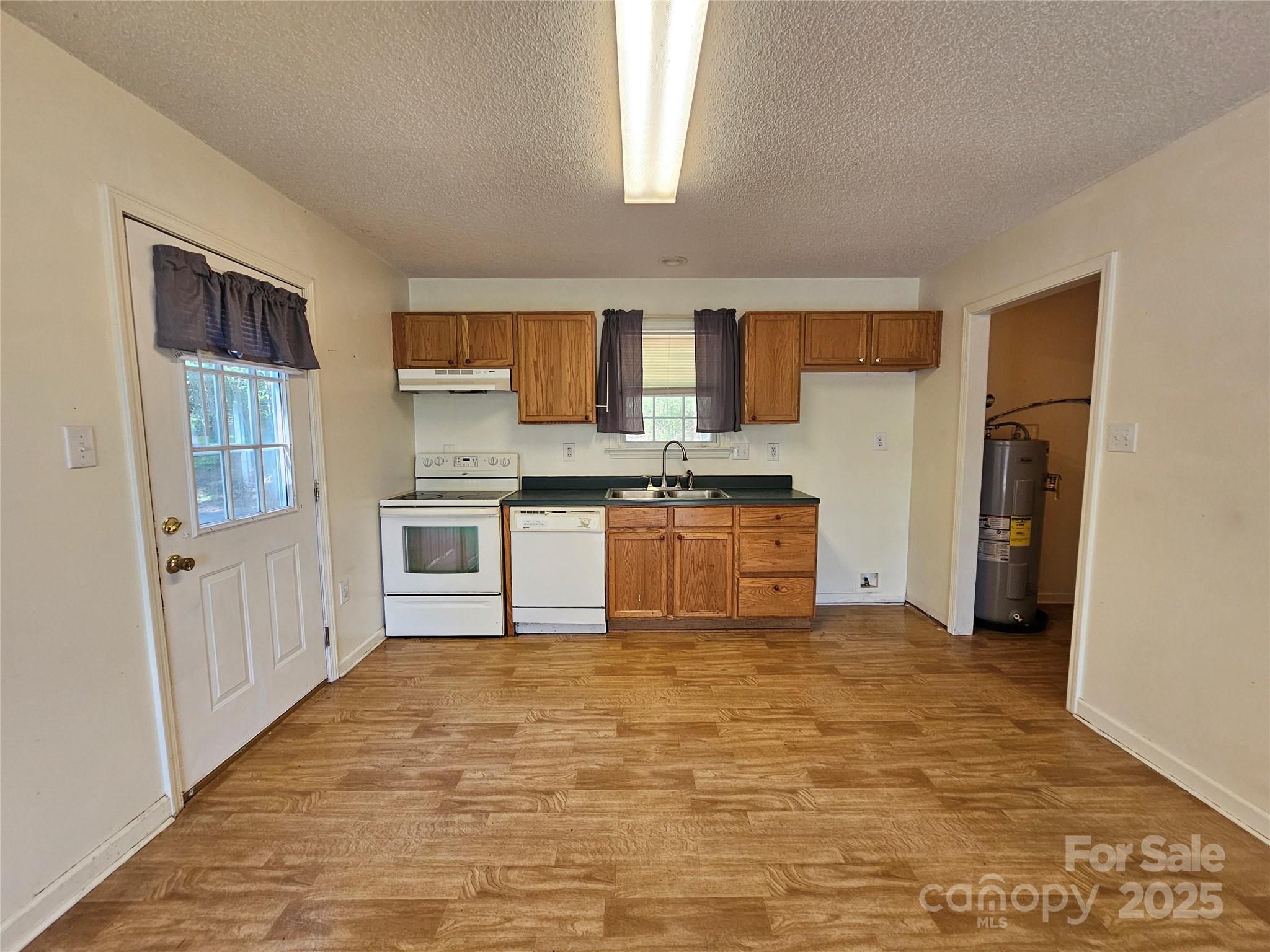 130 Susan Road, Unit 2 Casar, NC 28020 - Photo 4 of 12 a view of kitchen with refrigerator stove microwave and cabinets